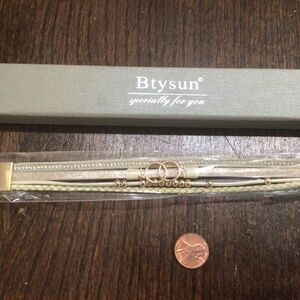 Btysun gold tone bracelet. New in package approx. 8” long